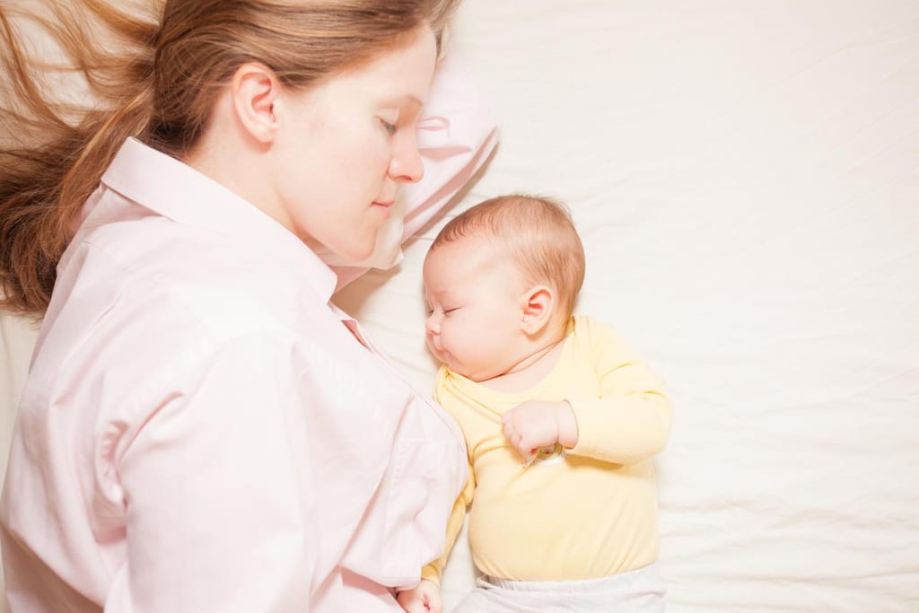 co-sleeping baby and mother