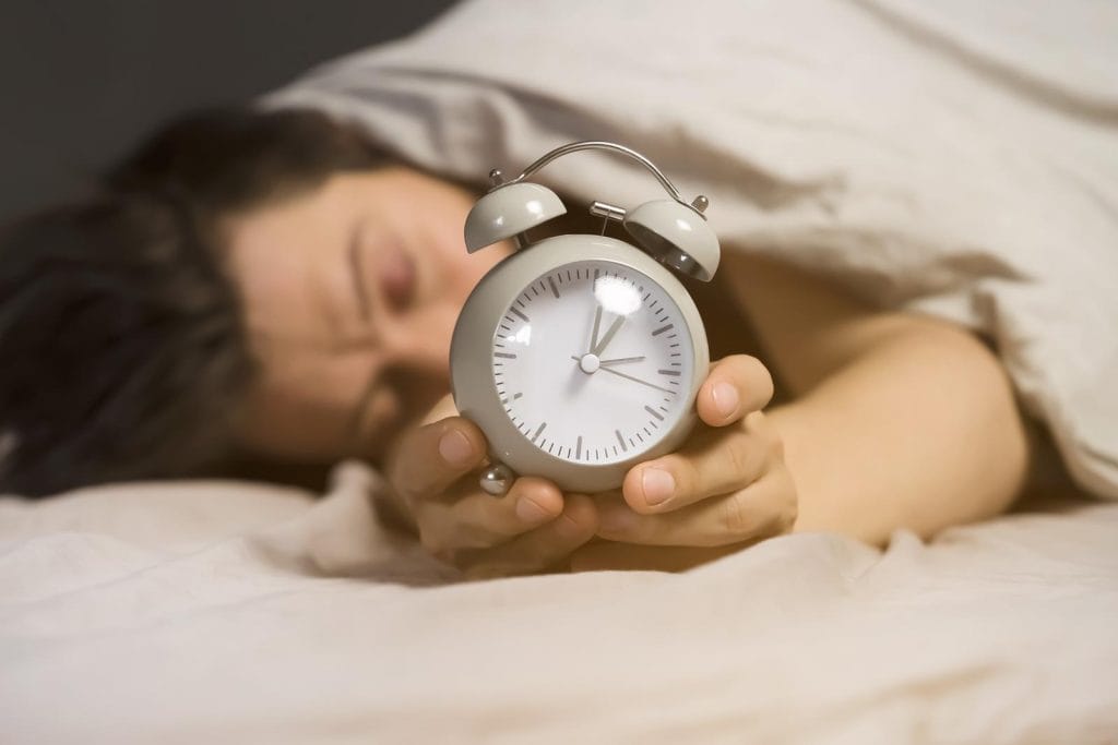 Man trying to fall asleep Melatonin